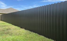 Uploaded Dura Fence reference photo with dark vertical ribbed panels
